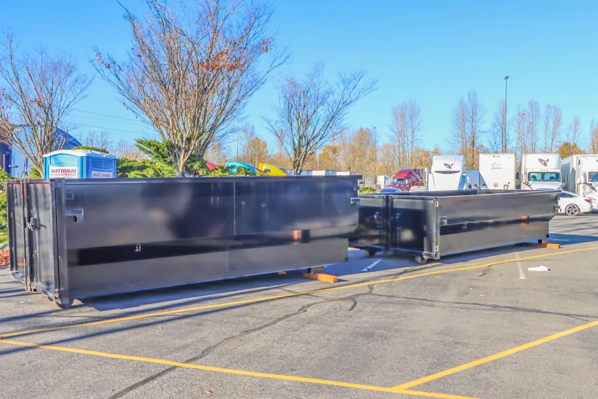 Professional dumpster rental service with roll-off container on residential driveway in Shippensburg